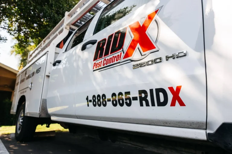 RidX pest control truck serving a Fresno, CA neighborhood